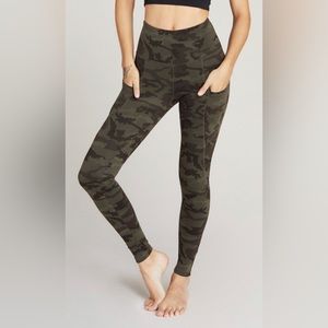 Solidcore-branded camo print leggings, size medium.